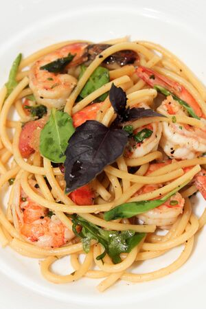 Spaghetti with prawn,cherry tomato and basilの写真素材