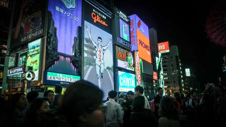 Osaka, Japan - April 1, 2018 :Tourist walking in night shopping street at Dotonbori, Dotonbori the famous destination for traveller in Osaka City, Osaka, Japan.のeditorial素材