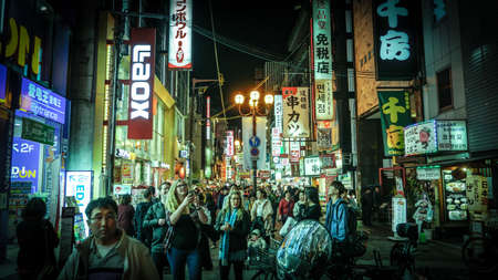 Osaka, Japan - April 1, 2018 :Tourist walking in night shopping street at Dotonbori, Dotonbori the famous destination for traveller in Osaka City, Osaka, Japan.のeditorial素材