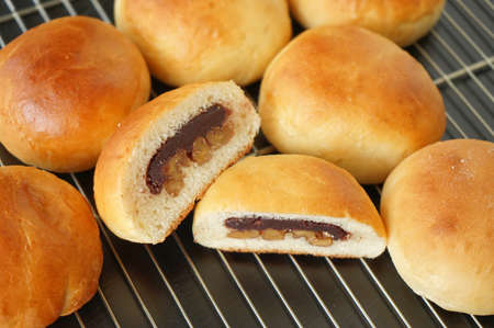 the Freshly baked buns lotus red beancut in half put side by side