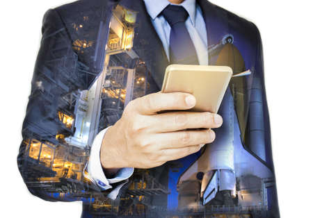 Double exposure of hand hold  smart phone with spaceport  .