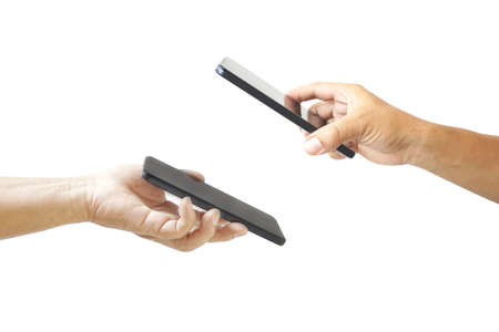 Hands using smartphones for scanning, sending information, adding friends and paying.の写真素材