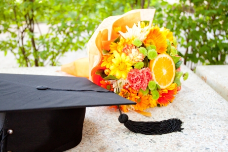 Graduation cap and  beautiful flowerの写真素材