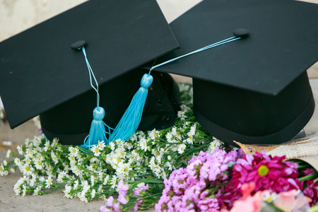 Graduation cap and beautiful flowerの写真素材