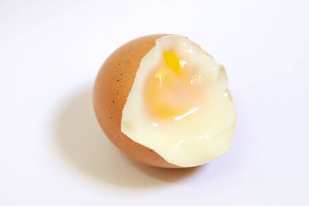 Fresh soft boiled eggs for breakfast on white backgroundの写真素材