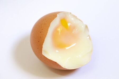 Fresh soft boiled eggs for breakfast on white backgroundの写真素材