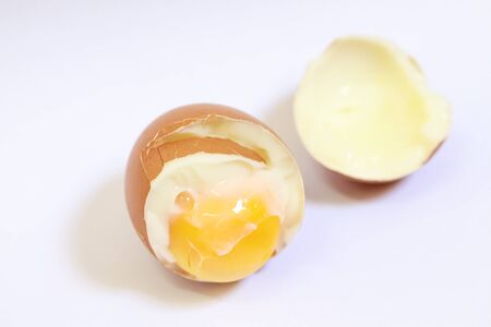 Fresh soft boiled eggs for breakfast on white backgroundの写真素材
