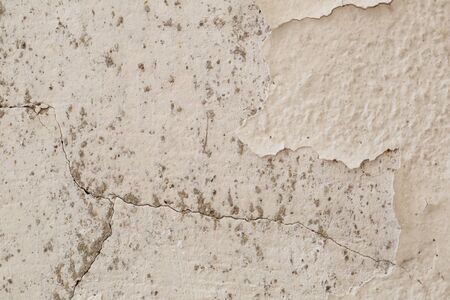 Cracked cement white wall backgroundの写真素材