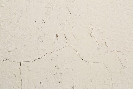 Cracked cement white wall backgroundの写真素材