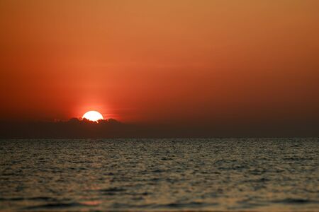 Beautiful sunset over the ocean sky clouds sunset landscape.の写真素材