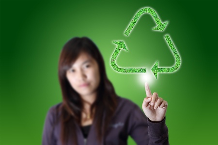 Recycle Logo on Female handsの写真素材