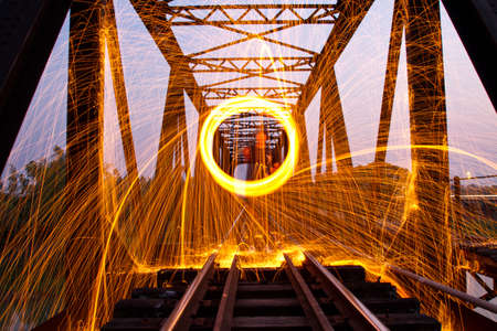 Burning steel wool fireworks in Railwayの写真素材