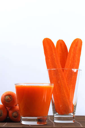 Carrot cut into slices and carrot juice の写真素材