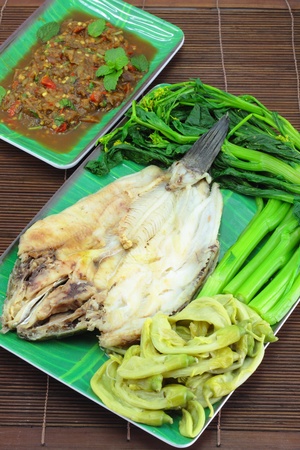 Thai cuisine name Steamed fish with boiled vegetables and sauce の写真素材