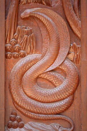 Animal carvings on the windows of the temple cult of Thailand の写真素材