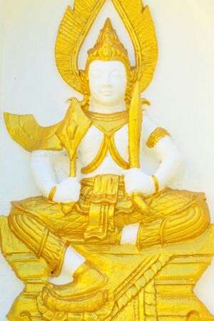 Armed goddess statue on the wall of the pagoda of Wat Thai の写真素材
