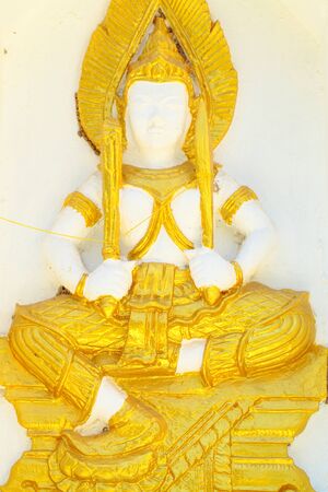 Armed goddess statue on the wall of the pagoda of Wat Thai の写真素材