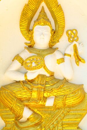 Armed goddess statue on the wall of the pagoda of Wat Thai の写真素材