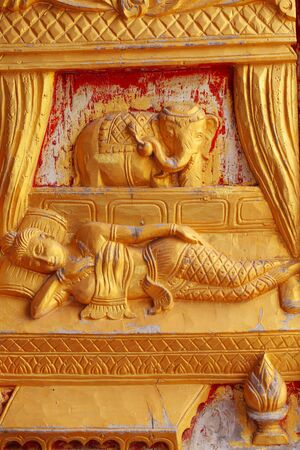 One of the carvings of many stories about the Buddha  Thai Buddhist Temple in the door の写真素材