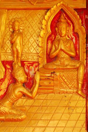 One of the carvings of many stories about the Buddha  Thai Buddhist Temple in the door の写真素材
