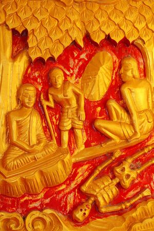 One of the carvings of many stories about the Buddha  Thai Buddhist Temple in the door の写真素材