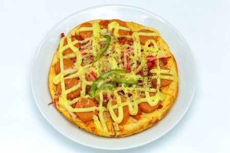 Fancy pizza sausage and beverages の写真素材
