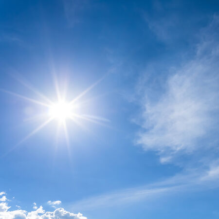 Hot and sunny daytime sky.の写真素材