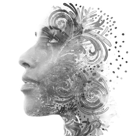 Double exposure. Paintography. Portrait of a beautiful young female model disappearing behind black ink painting on white backgroundの写真素材
