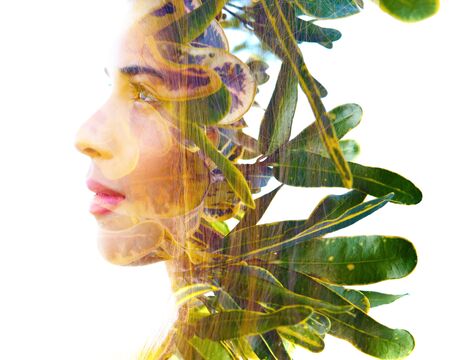 Double exposure with an ecological concept showcasing the beautiful femine nature of plantsの写真素材