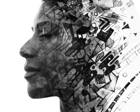 Double exposure. Paintography. Portrait of a beautiful young female model disappearing behind black...