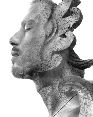 Double exposure profile portrait of young male traveller combined with close up of a rock sculpture...
