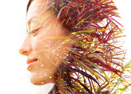 Double exposure profile portrait of a young, relaxed natural beauty with closed eyes and a smile...