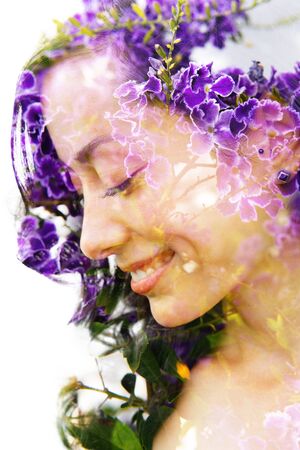 Double exposure with an ecological concept showcasing the beautiful feminine nature of purple flowersの写真素材
