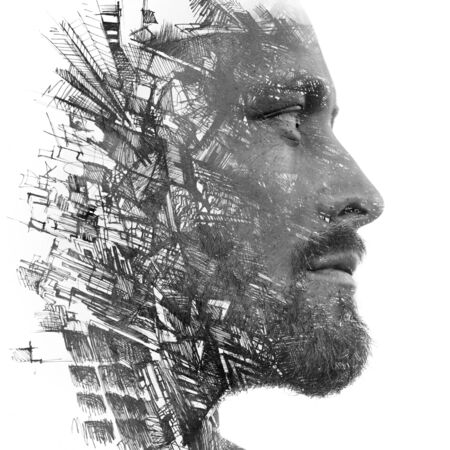 Paintography. Double exposure portrait of a man with strong features combined with handmade painting of repetitive lines which dissolve into his skinの写真素材