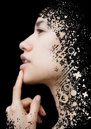 A young woman against black background profile portrait combined with abstract digital illustrationの写真素材