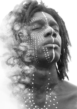 A mans face portrait turning into an abstract swirlの写真素材