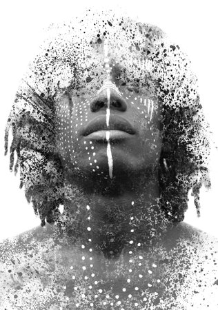 A concept black and white portrait combined with ink and paint splashesの写真素材