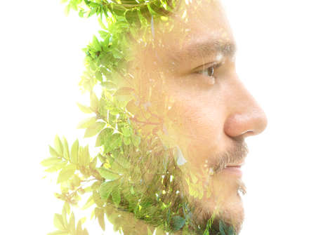 A mans profile portrait combined with a tree double exposure