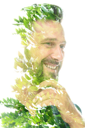 A double exposure shiny portrait of a smiling manの写真素材