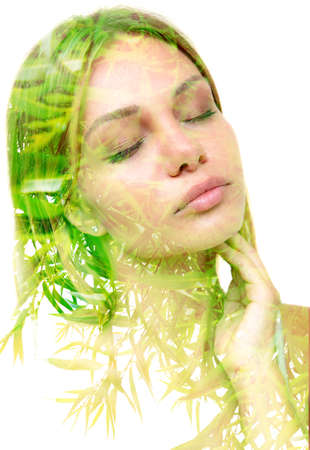 Double exposure portrait of an attractive woman combined with a photograph of an exotic plant