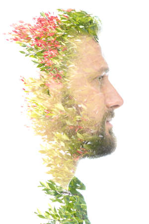 A portrait of a man combined with blooming plantsの写真素材