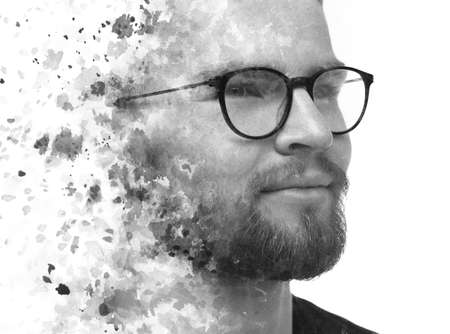 Double exposure of a black and white portrait of a man and watercolor splashes