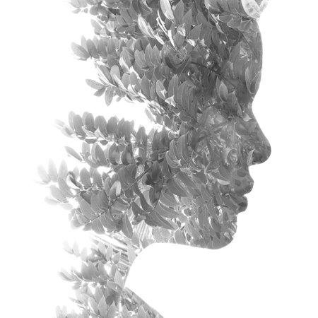 A black and white portrait of a woman combined with an image of nature.の写真素材