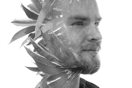 Double exposure portrait of young man immersed in his thoughts