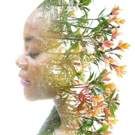 Double exposure portrait of a young woman combined with flowers.