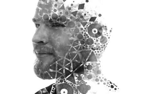 A double exposure portrait of a man combined with abstract geometric shapes.の写真素材