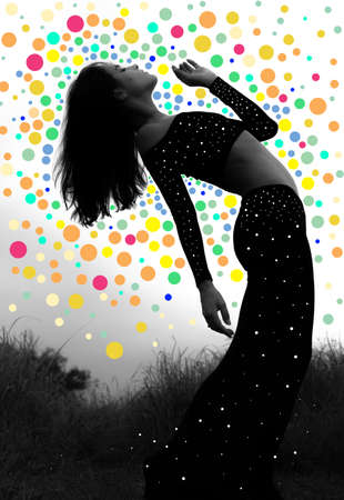 Portrait of a young, elegant, girl with a long dress and sharp features striking a dancers pose, black and whiteの写真素材