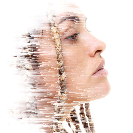 A double exposure portrait of an attractive woman combined with digital art.の写真素材