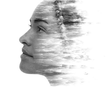 A profile portrait of a woman with visual distortion. Double exposure.の写真素材