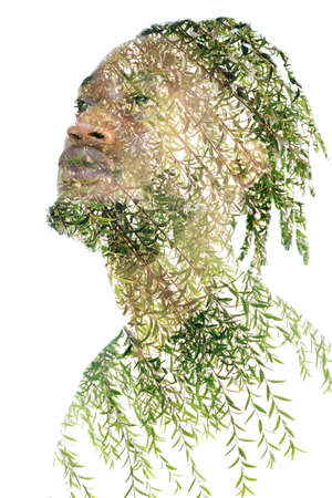 A portrait of a man combined with wild nature in a double exposure technique.